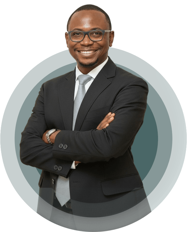 Kúnlé Ìlòrí-Diamond in a dark suit and glasses, arms folded, smiling.