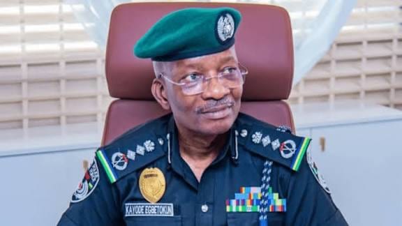 Inspector-General of Police Kayode Egbetokun seated in uniform and green beret, on affordable housing for Nigerian police officers.