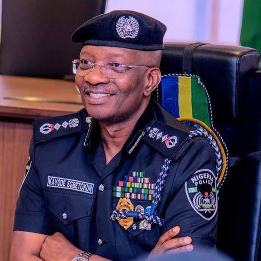 Nigeria's Inspector-General of Police, Kayode Egbetokun, in black uniform and beret with medal ribbons, whose police housing and mortgage proposal this article examines.